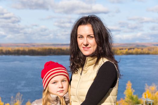 Photo of mother and daughter in autumn