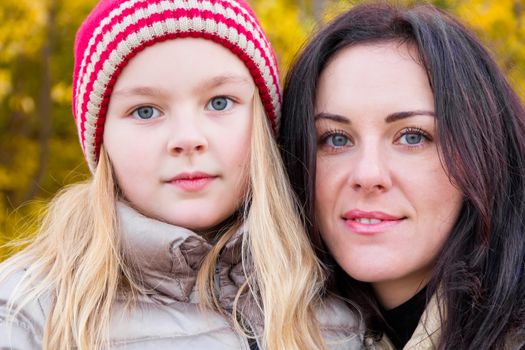 Photo of mother and daughter in autumn