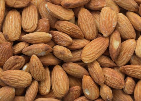 Closeup of whole almond nuts for background
