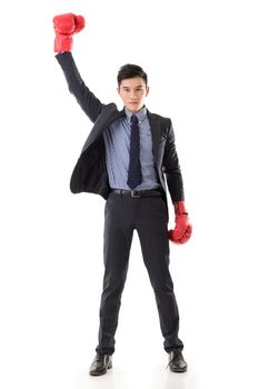 Asian businessman with boxing gloves, full length portrait isolated on white background. Concept about fight, struggle, against etc.