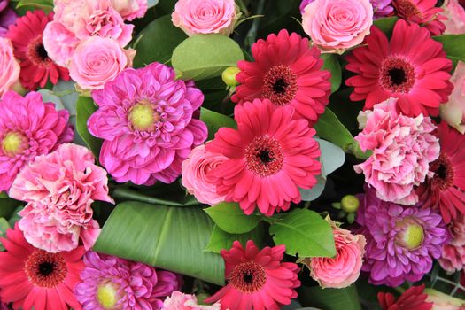 Floral wedding arrangement in various shades of pink and purple