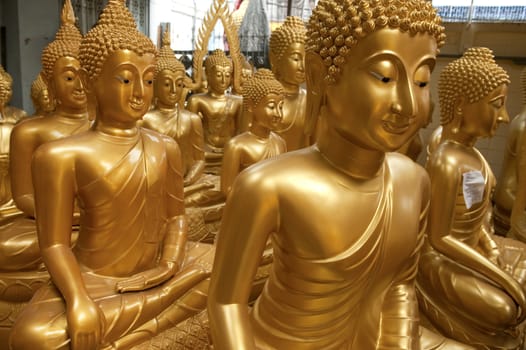 Buddha statues in shop, Thailand.