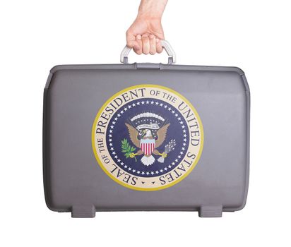 Used plastic suitcase with stains and scratches, printed with sign, presidential seal (USA)