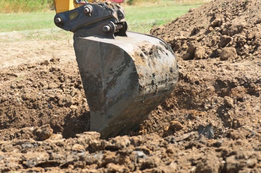 Mechanical digger on ground