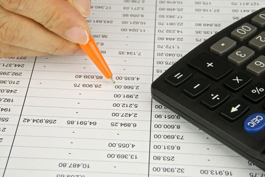 Man hold orange pen is planning finance account with calculator.