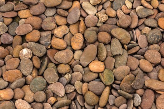 Pile of round peeble stones for background