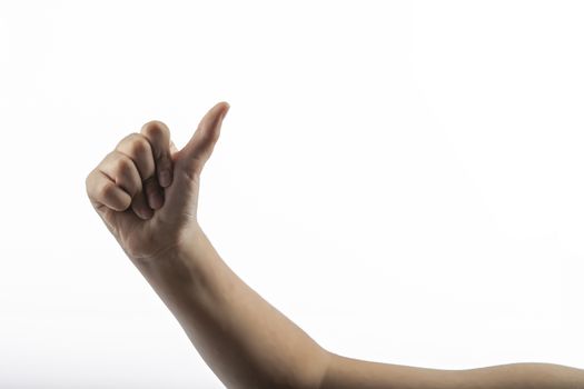 Young hands makes a gesture: hitchhiking sign 