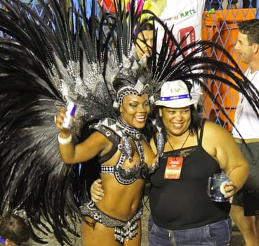 A spectator and an entertainer posing for their photo at a carnaval in Rio de Janeiro, Brazil
03 Mar 2014
No model release
Editorial only