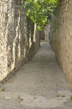 Stone alley in the village of Trujillo, in Caceres, Spain