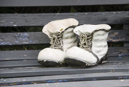 decoration of high shoes on wooden bench