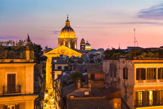 Night view of San Carlo al Corso, Chiesa di San Rocco all'Augusteo and St. Peter's cathedral in Vatican City Rome Italy.