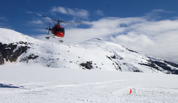 Helicpter landing on Alaskan Glacier