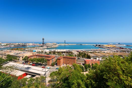 Spain, Barcelona cityscape with the port and the sea. Aerial view seen from Montjuic hill.