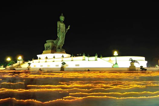 Walk with lighted candles in hand around at Phutamonthon Park ,Nakhon Pathom Province,Thailand