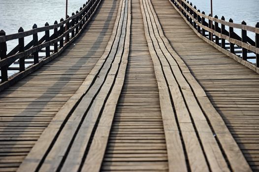 old an long wooden bridge at Sangklaburi,Kanchan aburi province, Thailand