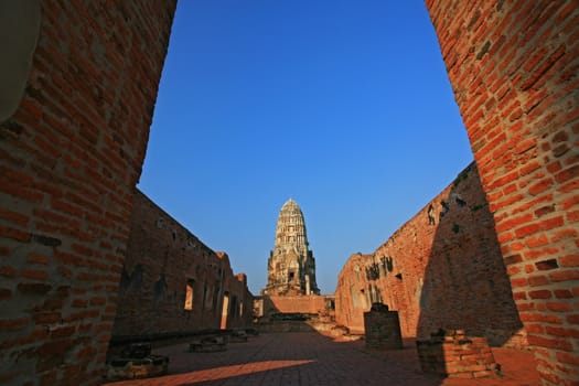 Wat Rajaburana gate and central tower in the background in Ayutthaya, Thailand.