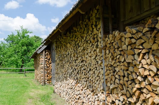 wood arranged exactly in shed village outdoor