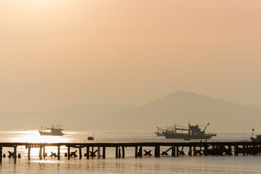 Pier in Morning Mist. Fishing Boats in Sattahip.