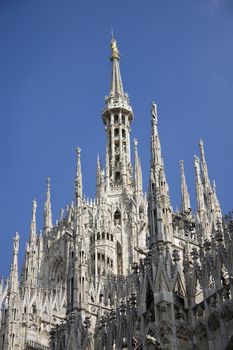Side facade of Duomo - cathedral in Milan, Italy.