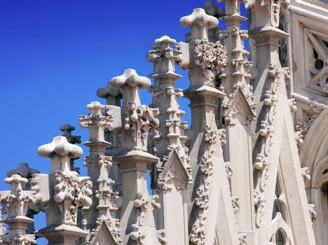Motif decorations at the roof terrace of Duomo, cathedral in Milan, Italy
