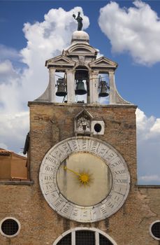 A clock tower with 24hr clock face in Venice, Italy