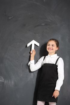 Schoolgirl at the blackboard .