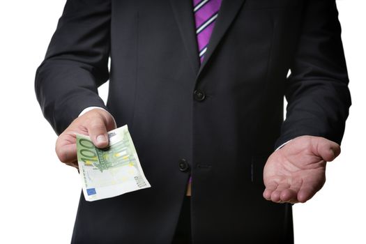 Businessman in dark suit is offering a banknote and holding his hand on