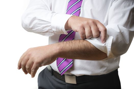 Business man in suit and a white shirt with tie rolls up his sleeves, isolated on white background