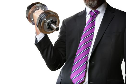 Businessman in black suit holding a silver dumbbell in the right hand