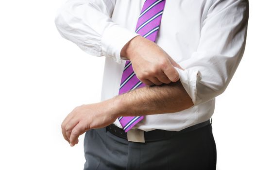 Business man in suit and a white shirt with tie rolls up his sleeves, isolated on white background