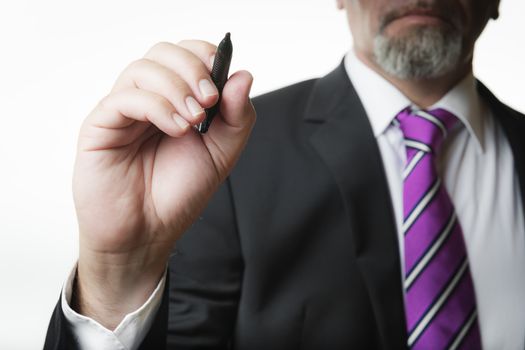 Business man with marker isolated on white background