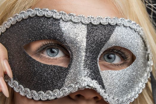 closeup of the eyes of a woman with carnival masquerade