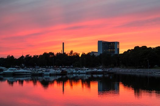 Red sunset over small harbor