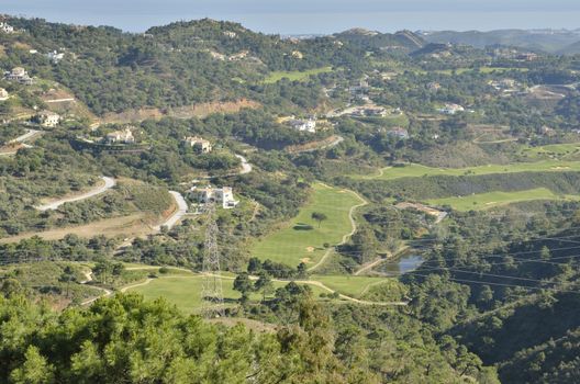 Golf course in a natural setting of mountains in Benahavis, Malaga, Spain.