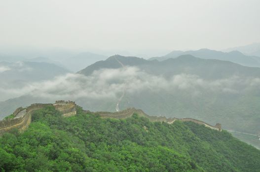 Great Wall fog over mountains in Beijing, China.