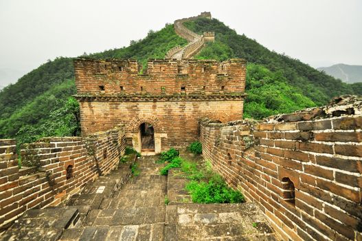 Great Wall fog over mountains in Beijing, China.