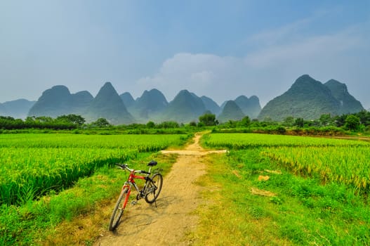 biking on Beautiful Li river side Karst mountain landscape in Yangshuo Guilin, China
