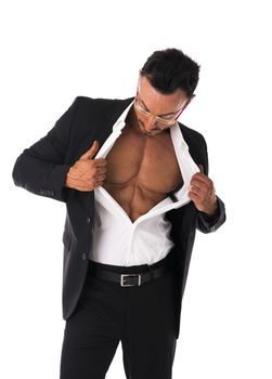 Businessman opening his shirt revealing muscular torso, on white background