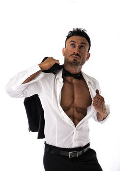 Businessman opening his shirt revealing muscular torso, on white background