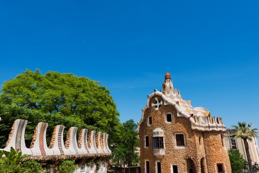 Casa del Guarda on blue sky (lodge) in Park Guell (1900-1914) of Barcelona - Spain. Architect Antoni Gaudi (1852-1926)