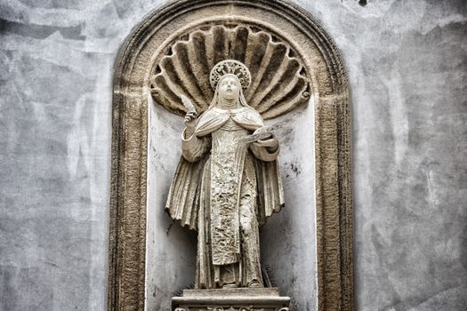 St. Therese of Lisieux statue on the facade of the church and convent of Carmelitane Scalze  in the old town of Gallipoli (Le)