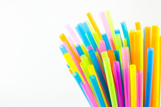 Closeup view of colorful drinking straws isolated on white background