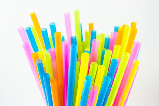 Closeup view of colorful drinking straws isolated on white background