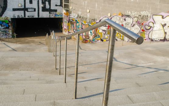 iron stair railings leading to the underground street crossing