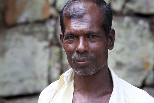 SIGIRIA, SRI LANKA (CEYLON) - 02 APRIL, 2011: An unidentified of adult man of Asian with smile on Ceylon, 2 April, 2011, Sigiria. Sri Lanka