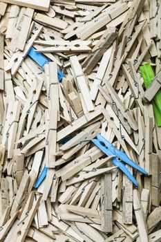 a lot of old fashioned wooden clothes pins