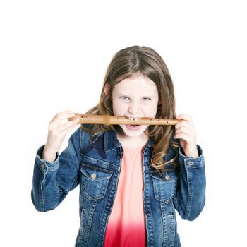 young girl with soprano recorder and white background