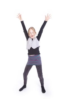 young blond girl cheering with raised arms in studio against white background