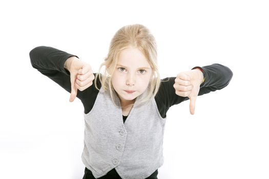 young girl in studio with both thumbs down against white background