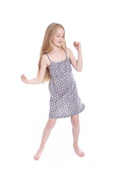 young blond girl dancing in studio against white background